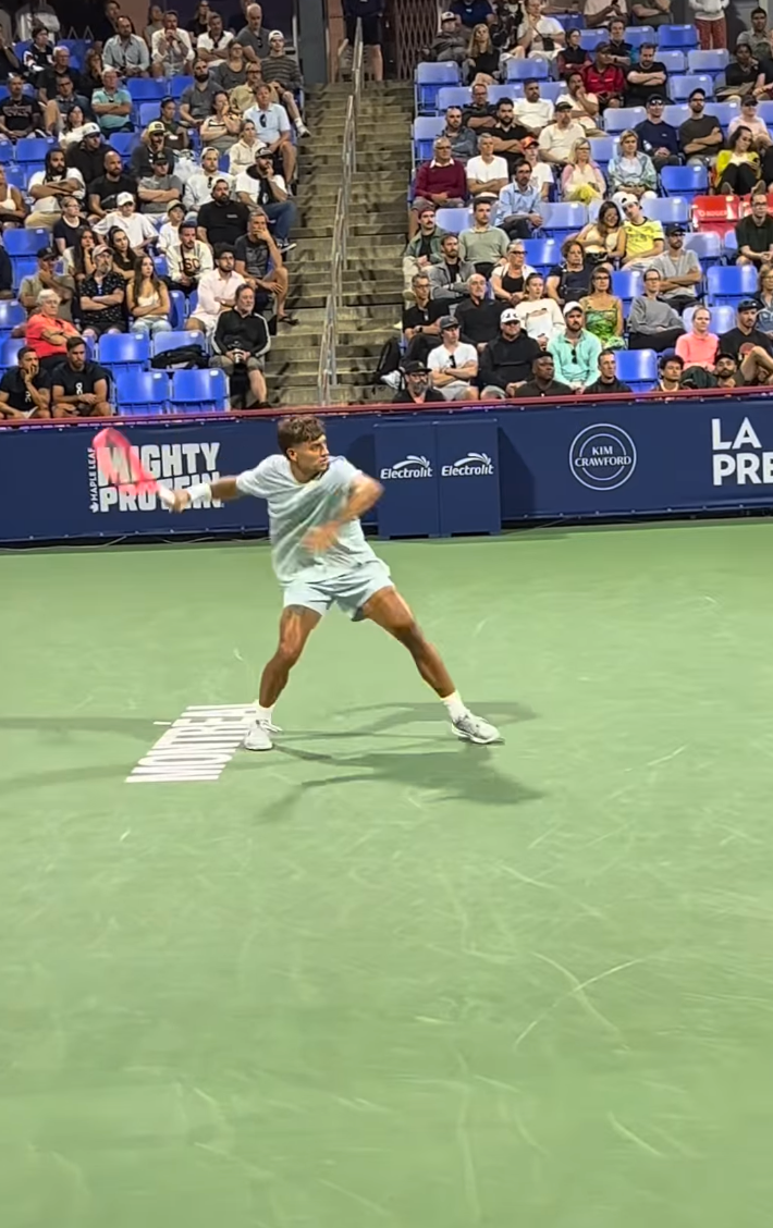 Professional tennis action captured from courtside